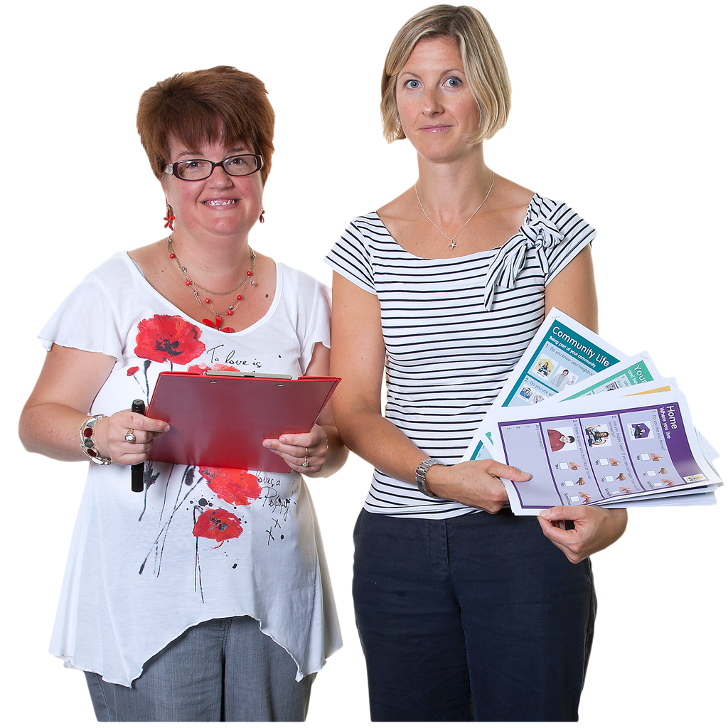 Two women stand next to each other, one holding a clipboard and pen, the other holding a selection of short Easy Read documents.